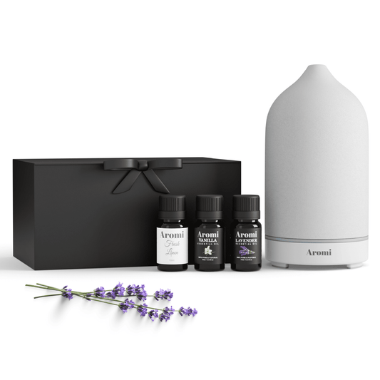 Diffuser och 3 eteriska oljor, frontvy vit bakgrund