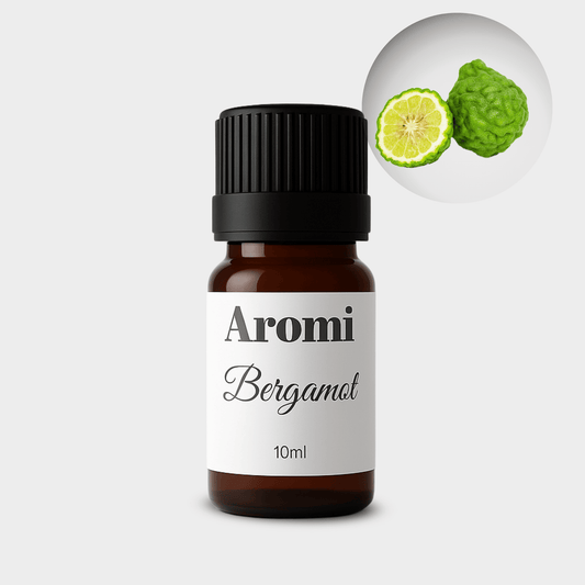 Bergamot eterisk olja, frontvy grå bakgrund