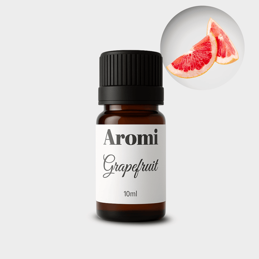 Grapefruit eterisk olja, frontvy grå bakgrund