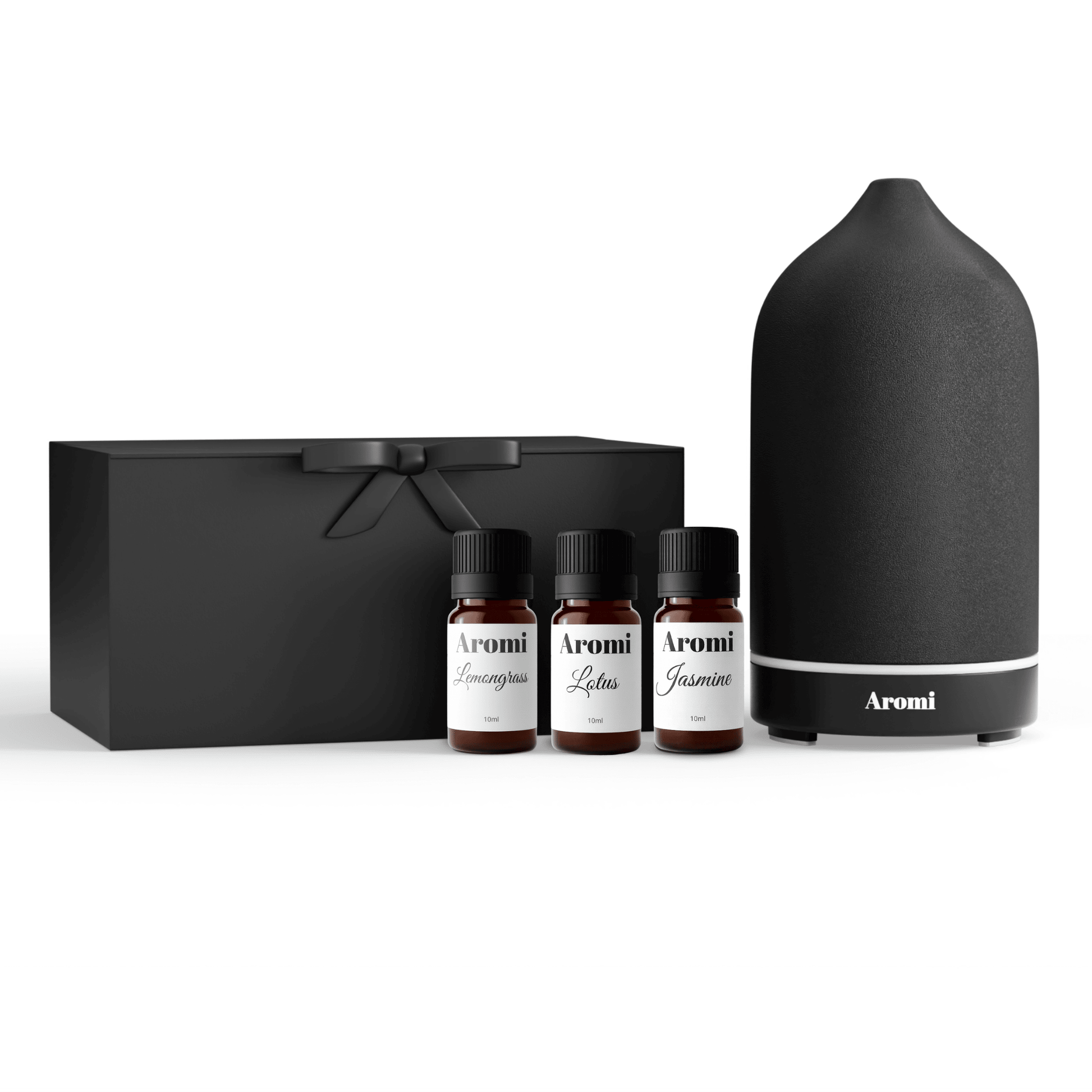 Svart diffuser och 3 eteriska oljor, frontvy vit bakgrund