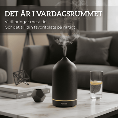 Svart keramisk diffuser i ett vardagsrum, frontvy